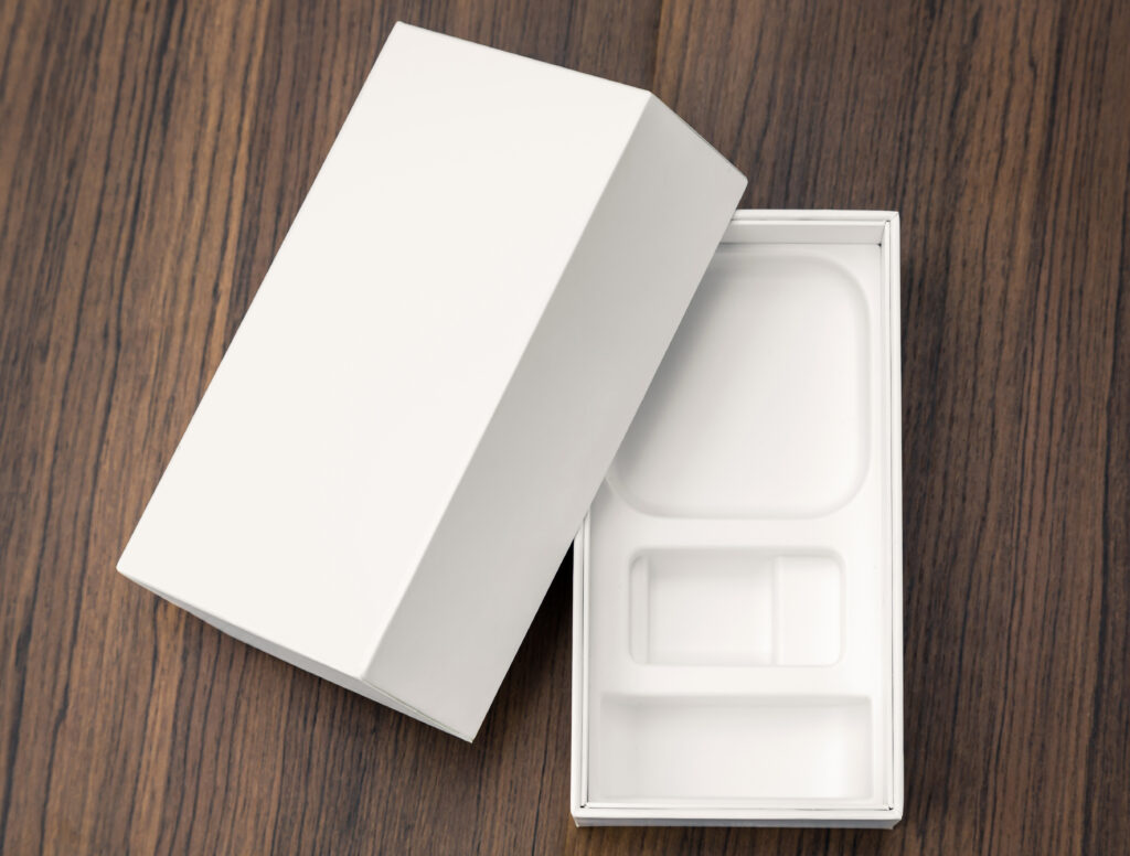 Blank white box mock up on wood background