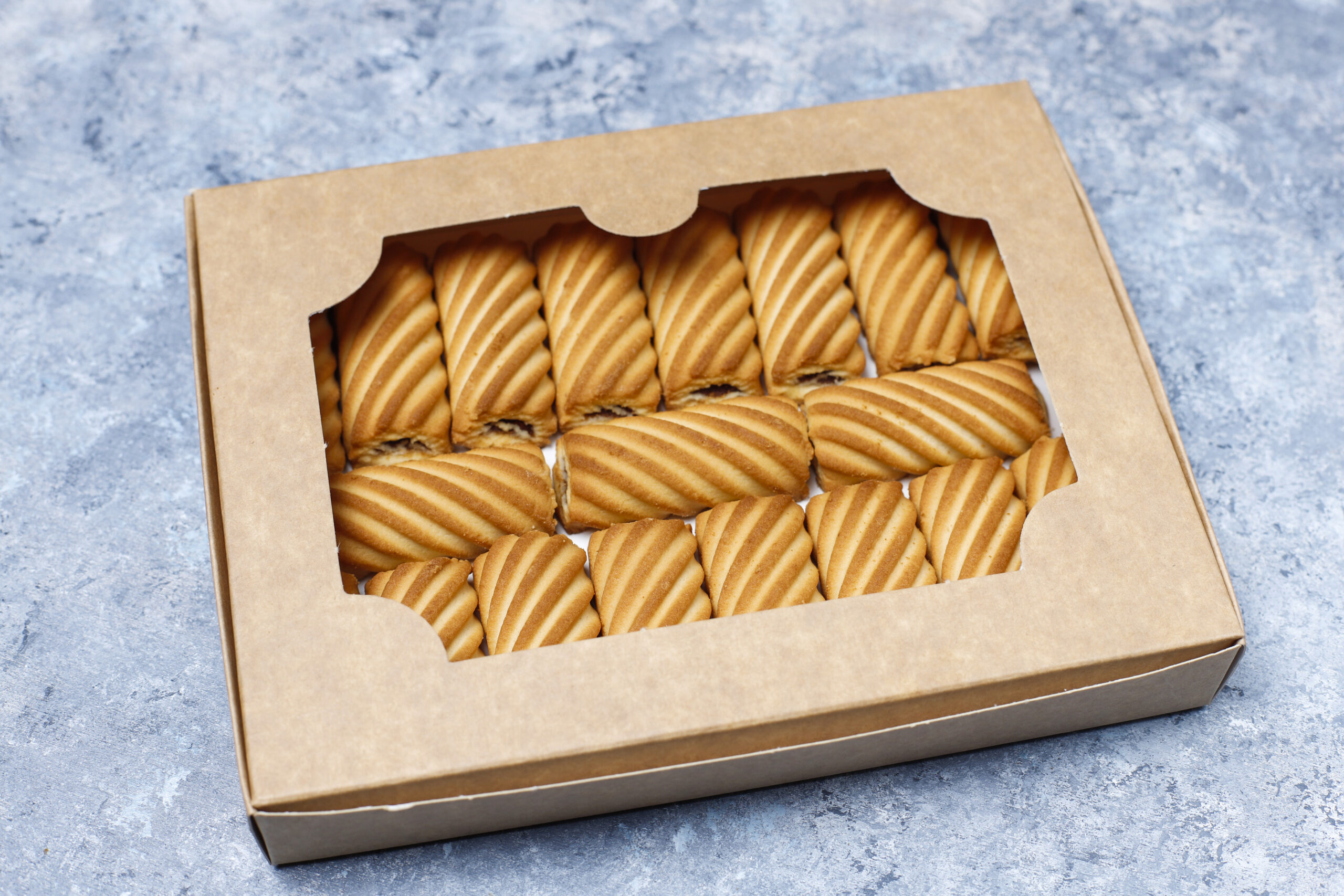cookies with jam filling on concrete background,top view